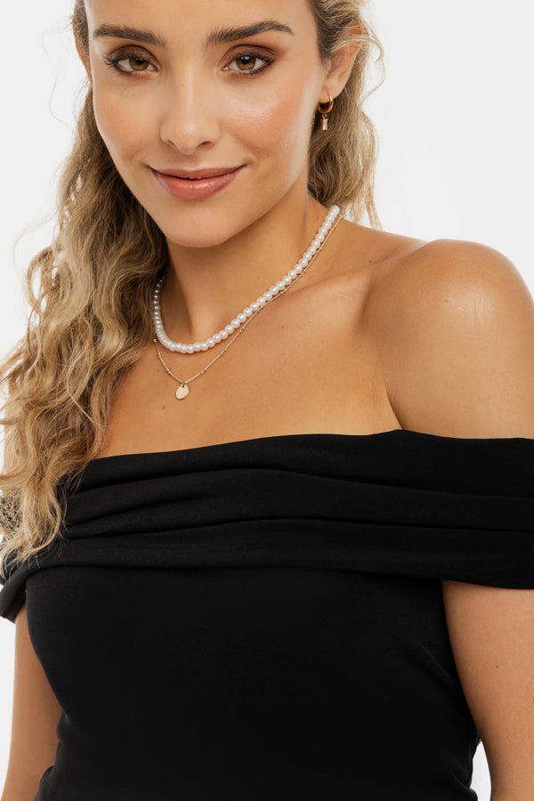 Elegante zwangerschapsblouse met off-shoulder – zwart